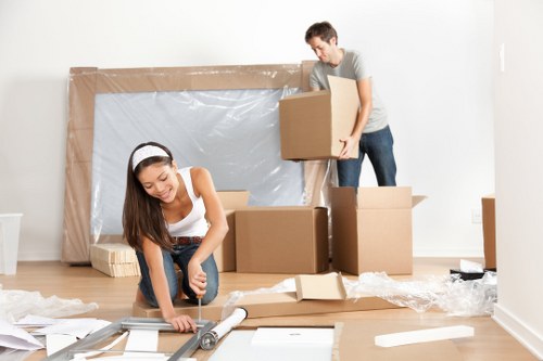 Moving van and packed boxes outside a Chiswick residential street