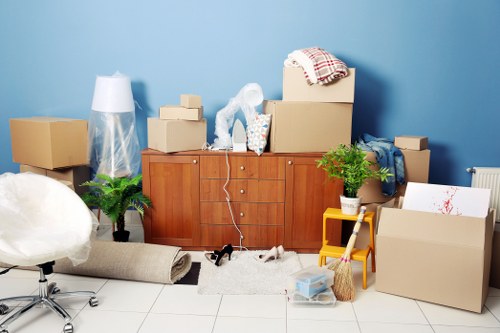 Furniture pick-up service handling bulky items in a Chiswick residential street