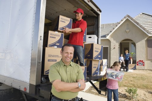 Packing boxes and wrapping household items for a move in Chiswick