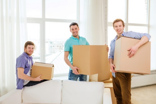 Professional movers loading items for removals in Chiswick