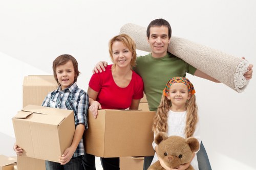 House removalists planning a move in Chiswick with packed boxes and furniture