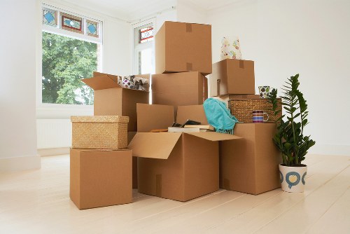 Professional movers handling apartment furniture in West London