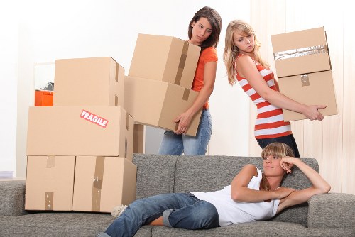 Preparation for a flat move with labelled boxes and household items